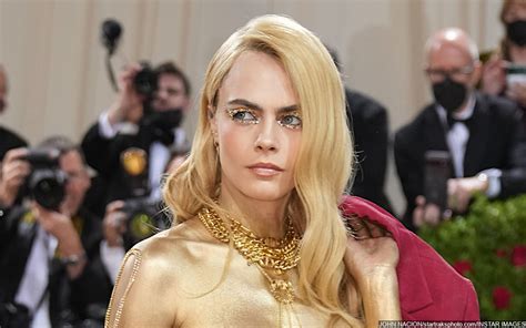 Cara Delevingne attended the Met Gala topless and painted in gold